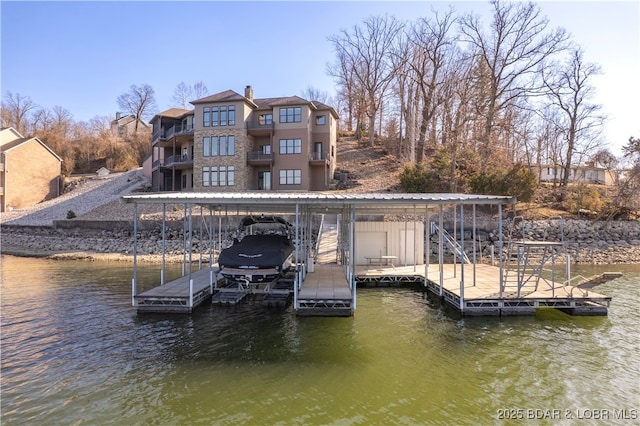 dock area with a water view and boat lift