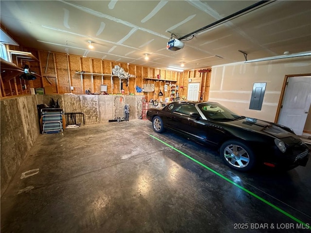 garage featuring electric panel and a garage door opener