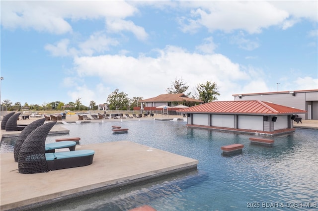 view of pool featuring a boat dock