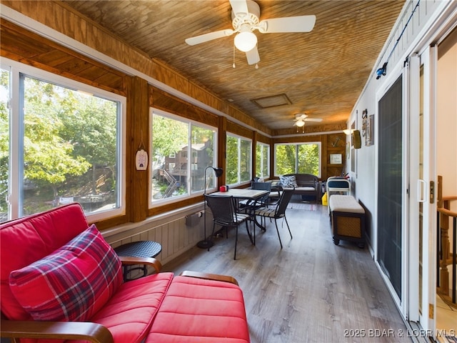 26509 Mesa Dr, Rocky Mount, MO 65072 - sunroom / solarium with wood ceiling, ceiling fan, an outdoor hangout area, wood finished floors, and outdoor dining area