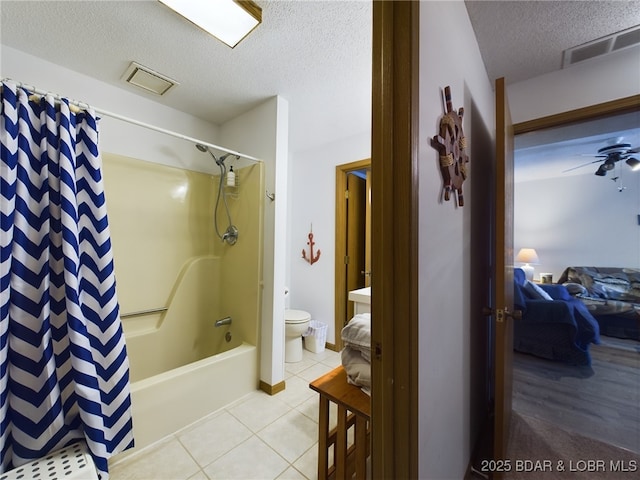 bathroom with tile patterned flooring, visible vents, a textured ceiling, and toilet