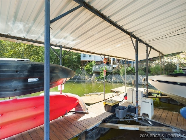 dock area featuring a water view and boat lift