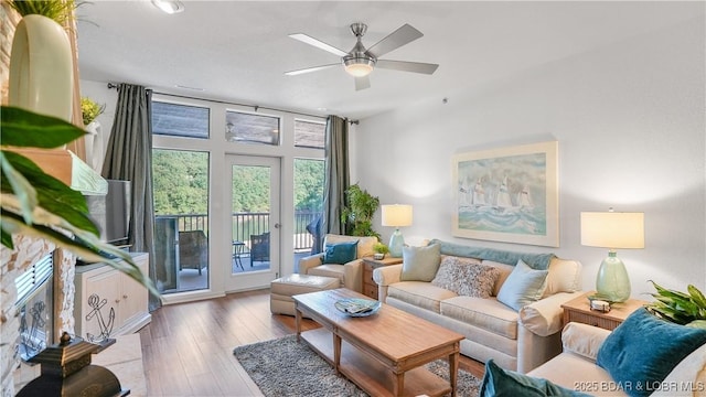 living room featuring ceiling fan and wood finished floors