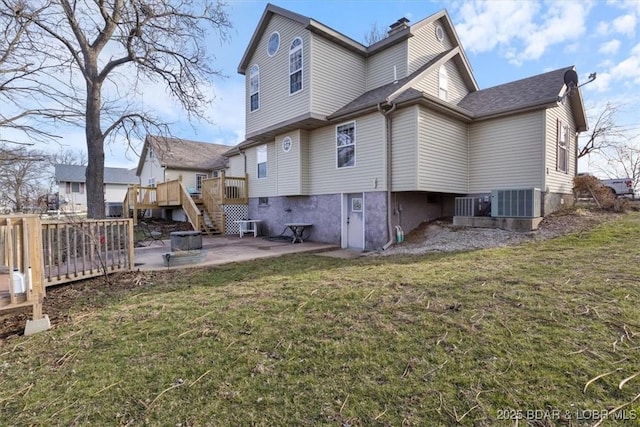 back of property with a wooden deck, central AC, a lawn, a chimney, and a patio area