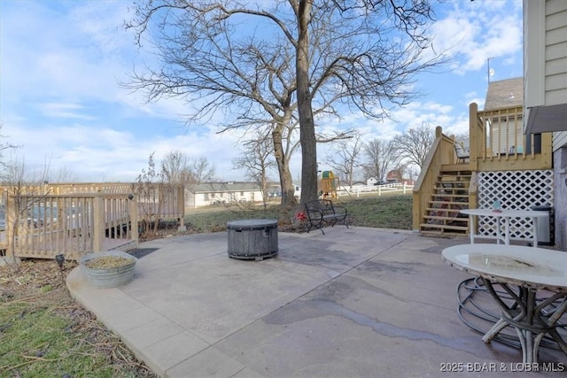 view of patio / terrace with a deck and stairs