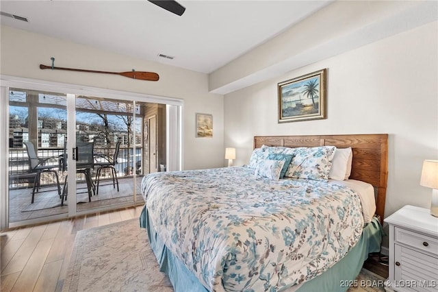 bedroom with access to exterior, a ceiling fan, visible vents, and light wood-type flooring