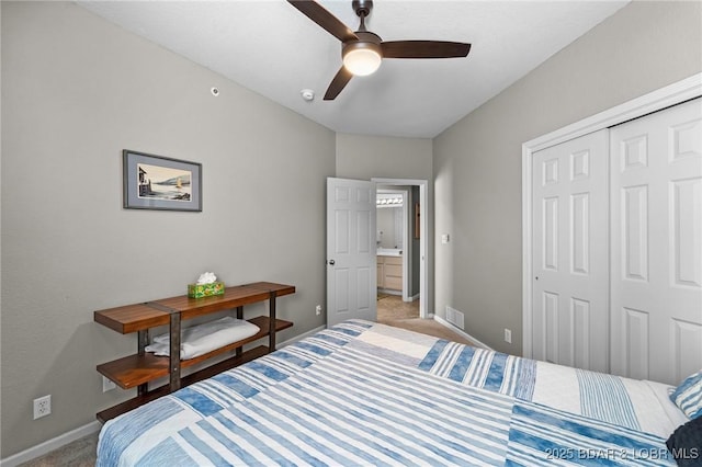 bedroom with light colored carpet, visible vents, a closet, and baseboards