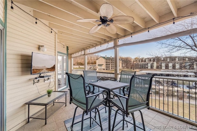 exterior space featuring a balcony and ceiling fan