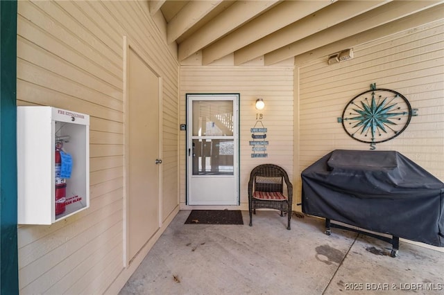 entrance to property with a patio area