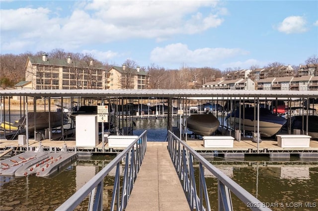 view of dock with a water view and boat lift