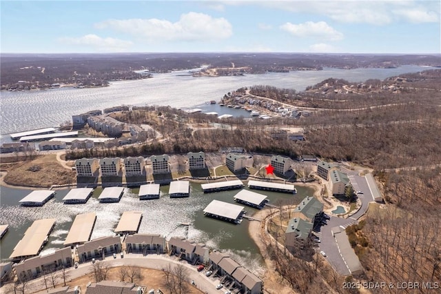 birds eye view of property featuring a water view