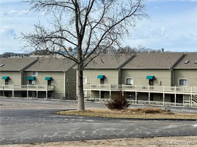 view of building exterior featuring fence