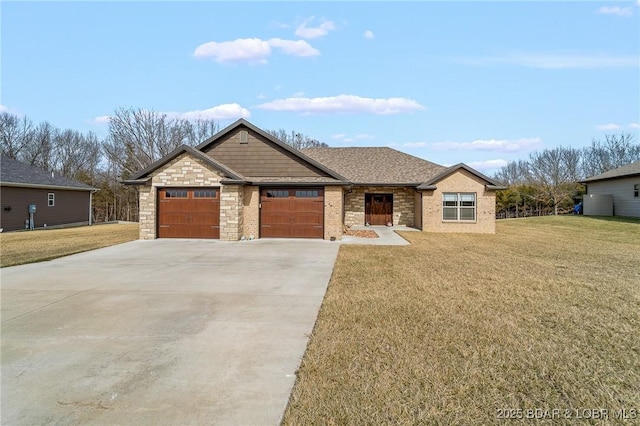 view of front facade featuring driveway, a front lawn, roof with shingles, an attached garage, and brick siding