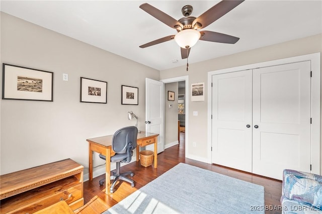 home office with ceiling fan, baseboards, and wood finished floors