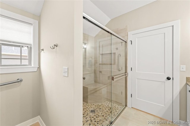 full bath featuring baseboards and a stall shower