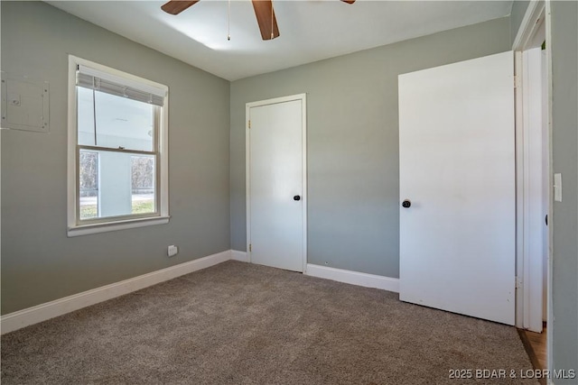 unfurnished bedroom featuring carpet flooring, ceiling fan, and baseboards