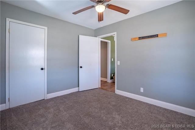 unfurnished bedroom featuring carpet flooring, ceiling fan, and baseboards