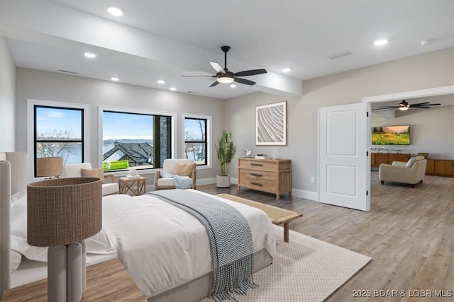 bedroom featuring light wood finished floors, baseboards, recessed lighting, and a ceiling fan