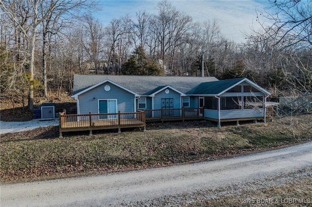 ranch-style home with a deck