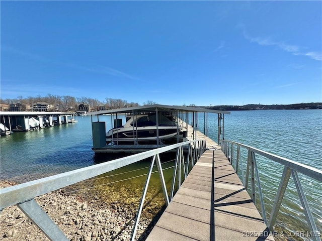 view of dock with a water view and boat lift