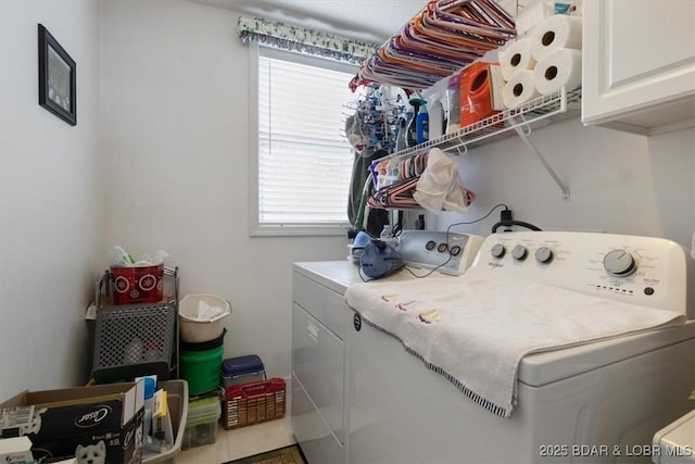 laundry room featuring cabinet space and independent washer and dryer