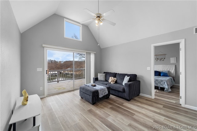 6504 Avalon Park, Osage Beach, MO 65065 - living room featuring a ceiling fan, high vaulted ceiling, light wood finished floors, and baseboards