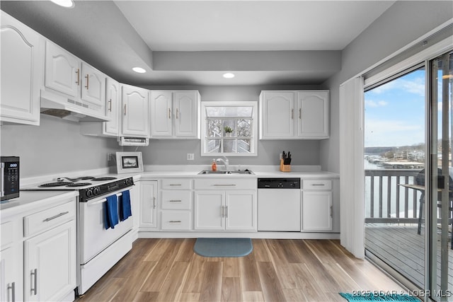 6504 Avalon Park, Osage Beach, MO 65065 - kitchen featuring white appliances, under cabinet range hood, a sink, recessed lighting, and white cabinetry