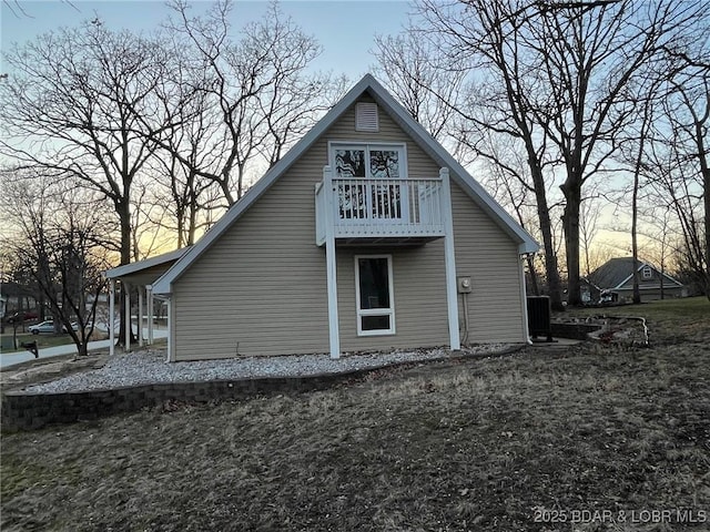 back of house with a balcony and central AC