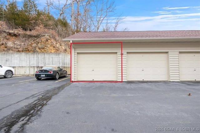 garage with fence