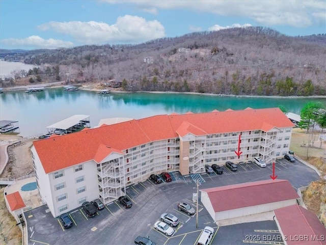 birds eye view of property featuring a water view