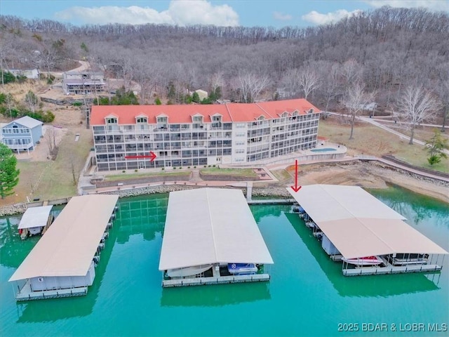 birds eye view of property with a water view