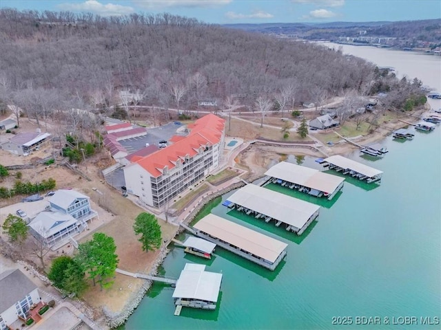 aerial view with a view of trees and a water view