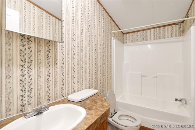 full bathroom with toilet, tub / shower combination, wallpapered walls, and vanity