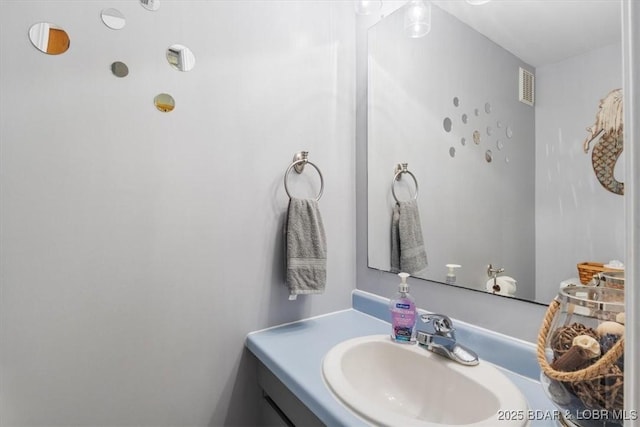 bathroom with vanity and visible vents