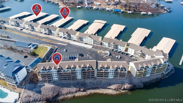 birds eye view of property with a water view