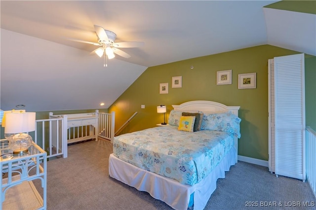 carpeted bedroom featuring vaulted ceiling, a ceiling fan, and baseboards