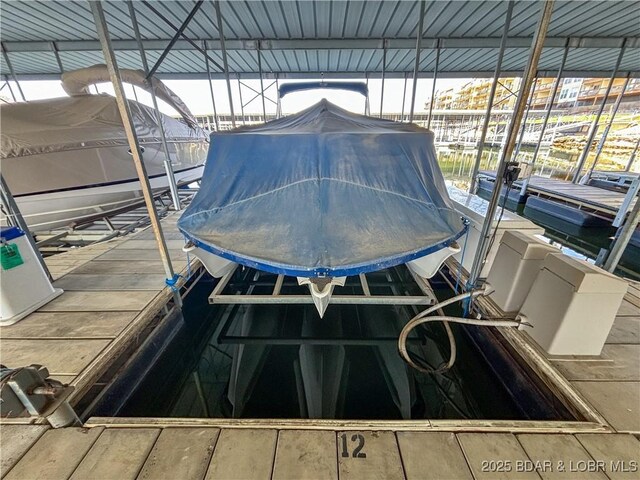 view of dock with boat lift