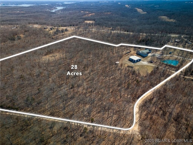 birds eye view of property with a rural view