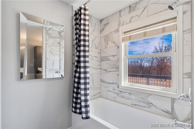 bathroom with shower / bathtub combination with curtain