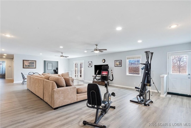 workout area with french doors, recessed lighting, baseboards, and light wood finished floors