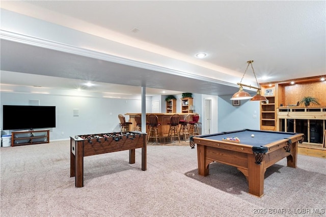 playroom featuring billiards, recessed lighting, a bar, a fireplace, and carpet flooring