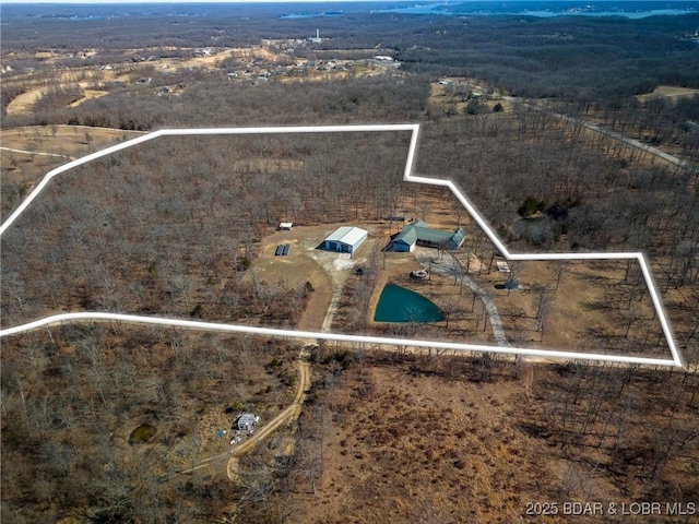 birds eye view of property with a rural view