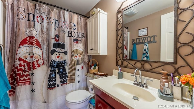 bathroom with visible vents, toilet, vanity, and a shower with curtain