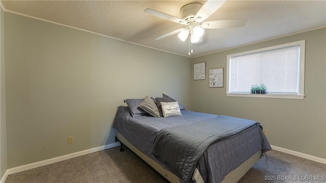 bedroom with a textured ceiling, crown molding, and carpet floors