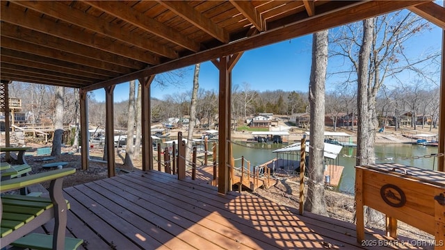 deck featuring a dock and a water view