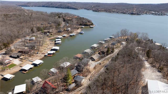 birds eye view of property featuring a water view