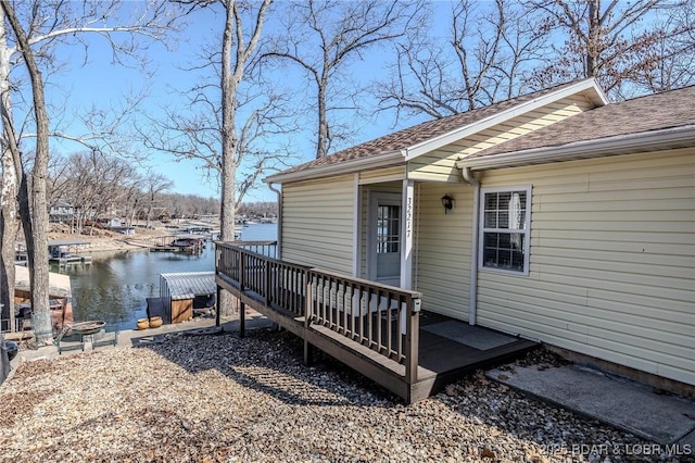 wooden deck with a water view