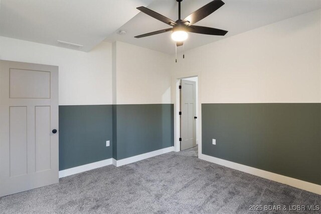 unfurnished room with baseboards, carpet floors, and ceiling fan