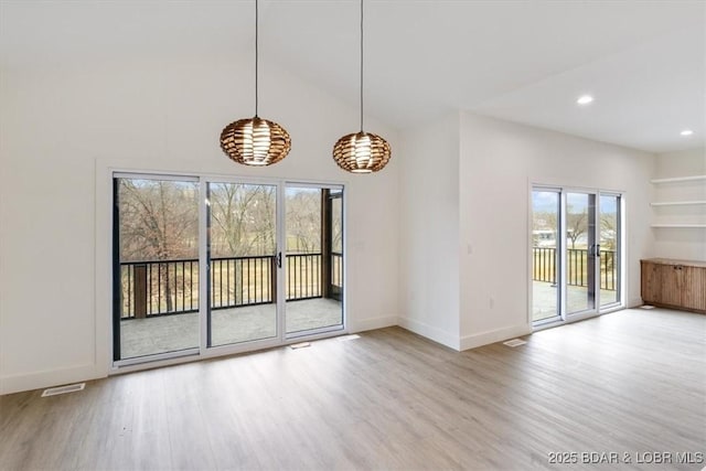 interior space with recessed lighting, wood finished floors, visible vents, and baseboards