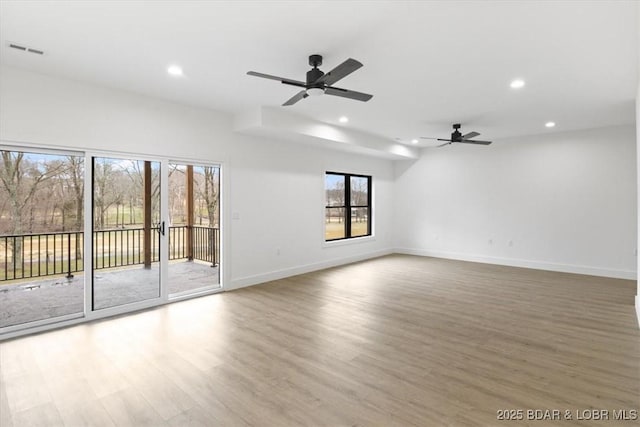 spare room with visible vents, ceiling fan, baseboards, recessed lighting, and wood finished floors